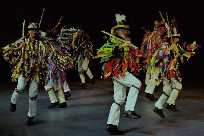 Mad Tatters Morris dance team performing on stage