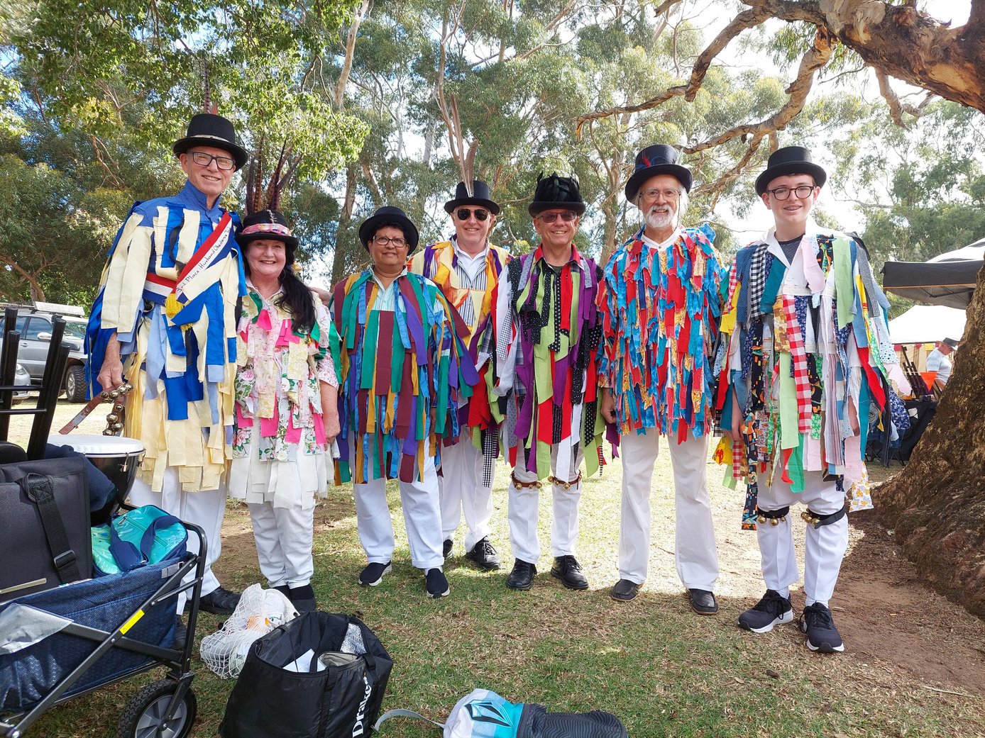Mad Tatters morris dance team posing for photo after a performance